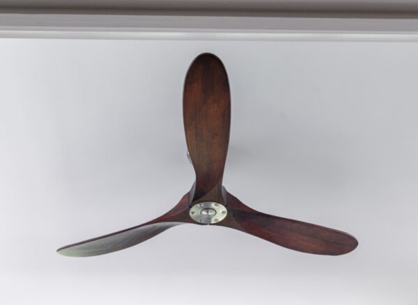 Luxury home design detail – sculptural walnut three-blade ceiling fan that blends art and function 